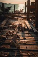 antiguo de madera muelle en el playa a puesta de sol. selectivo atención foto