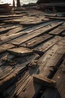 antiguo de madera muelle en el playa a puesta de sol. selectivo atención foto