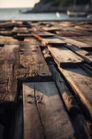 antiguo de madera muelle en el playa a puesta de sol. selectivo atención foto