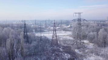 Aerial view of the power line near the railway in winter video
