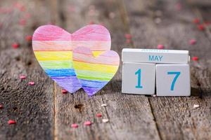 Wooden calendar with date 17 May and heart painted in rainbow color. International Day Against Homophobia, Transphobia and Biphobia. LGBT. photo