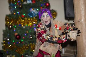 Baba Yaga on the background of the Christmas tree. photo