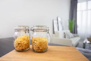 Jars of pasta on the background of the apartment. photo