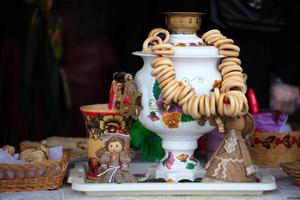 Belarus, the city of Gomil, February 24, 2020. Maslenitsa holiday.Russian samovar and a lot of bagels. Symbols of Russia. photo