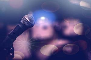 Microphone on a bokeh background. Musical background. photo