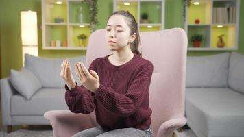 Muslim Asian Young Woman Praying at Home, Worship.  Happy Muslim Asia Young Woman Praying, Believing Islam Religion. video