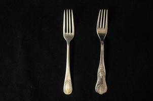 Forks on dark background photo