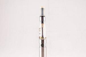 Electronic cigarette on white background photo