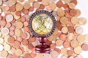 Earth globe and coins photo