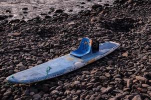 Blue boat on the shore photo