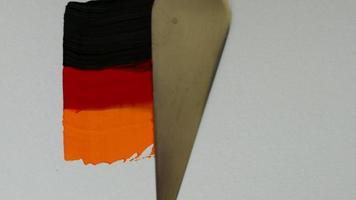 Creating a flag of Germany with acrylic paints and palette knife video