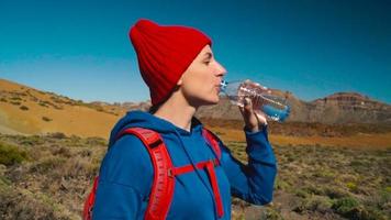 Active hiker woman hiking on Teide National Park and makes photo landscapes on the smartphone. Tenerife, Canary Islands video