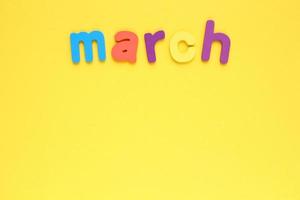 Calendar march list, daily planner for wall and desk on yellow background. To do, check list. Organizer, notebook with copy space. Business concept. Plan, action text. Schedule for month photo