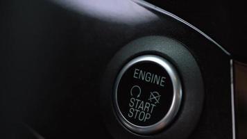 Close up of male finger pressing an engine start stop button in car video