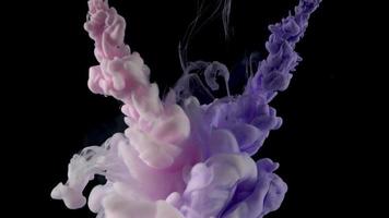 Color drop underwater creating a silk drapery. Ink swirling underwater. video