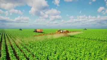 Agriculture tractor spraying fertilizer on soybean fields, Technology smart farm concept, 3d render photo