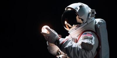 astronaut holding a light bulb copy space photo