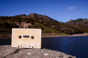 Vintage cassette on a rock photo