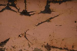 Rust and oxidized background. Old iron panel. Red, brown and black rust on the metal plate. Grunge rusted metal abstract texture. Rusted metal wall. Rusty metal surface with streaks of rust. photo