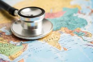 Bangkok, Thailand June 1, 2022, Stethoscope on Asia world globe map background. photo