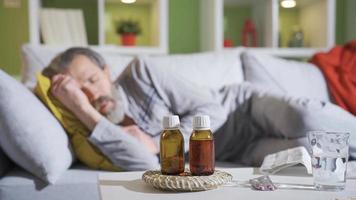 The elderly man, whose health is critical at home, coughs, has shortness of breath, and uses medication. video