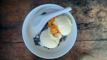 Bubur Ketan Hitam or black sticky rice porridge photo