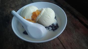 Bubur Ketan Hitam or black sticky rice porridge photo