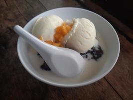 Bubur Ketan Hitam or black sticky rice porridge photo