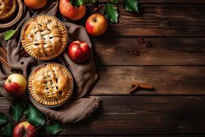 Homemade apple pie. Homemade Apple Pies on wooden background, top view. Classic autumn Thanksgiving dessert - organic apple pie. photo