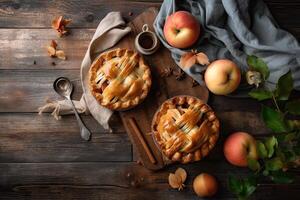 Homemade apple pie. Homemade Apple Pies on wooden background, top view. Classic autumn Thanksgiving dessert - organic apple pie. photo