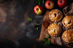 Homemade apple pie. Homemade Apple Pies on wooden background, top view. Classic autumn Thanksgiving dessert - organic apple pie. photo