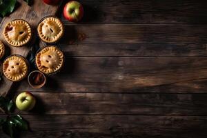 Homemade apple pie. Homemade Apple Pies on wooden background, top view. Classic autumn Thanksgiving dessert - organic apple pie. photo