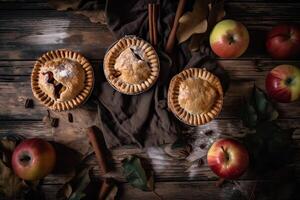 Homemade apple pie. Homemade Apple Pies on wooden background, top view. Classic autumn Thanksgiving dessert - organic apple pie. photo