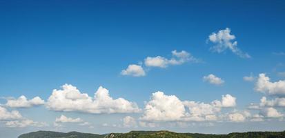 cloudy with blue sky over mountain photo