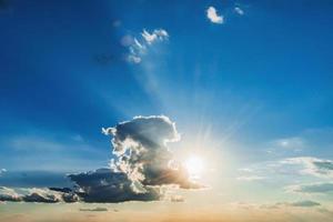 sun and white cloud with blue sky background photo