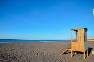 Wood booth on the beach photo