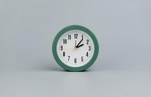Alarm clock on gray scene, time concept operation of time When it's important to work and live photo