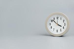 Alarm clock on gray scene, time concept operation of time When it's important to work and live photo