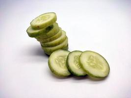 Slices of cucumbers isolated in white background photo