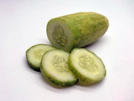 Slices of cucumbers isolated in white background photo
