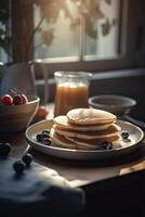 Delicious pancakes, with fresh blueberries, strawberries and maple syrup on a light background. With copy space. Sweet maple syrup flows from a stack of pancake. . photo