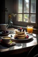 Delicious pancakes, with fresh blueberries, strawberries and maple syrup on a light background. With copy space. Sweet maple syrup flows from a stack of pancake. . photo