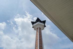 Main tower on Great agung mosque on the Semarang Central Java, when day time and blue sky. The photo is suitable to use for Ramadhan poster and Muslim content media.