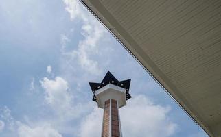 Main tower on Great agung mosque on the Semarang Central Java, when day time and blue sky. The photo is suitable to use for Ramadhan poster and Muslim content media.