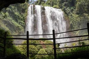Landscape photo of great water fall on the travel destination Semarang Central Java. The photo is suitable to use for adventure content media, nature poster and forest background.