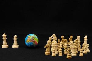 Earth and chess pieces photo