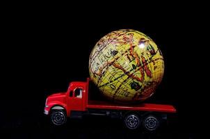 Toy car and an earth globe photo