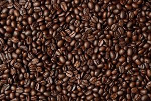 photo macro close up texture of roasted coffee beans dark, can be used as a background.