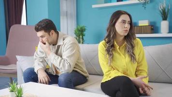 Resentful married couple ignore each other, have family relations problems. Young couple sitting separately at home upset after argument and angry conflict. Marriage problem. video