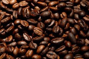 photo macro close up texture of roasted coffee beans dark, can be used as a background.
